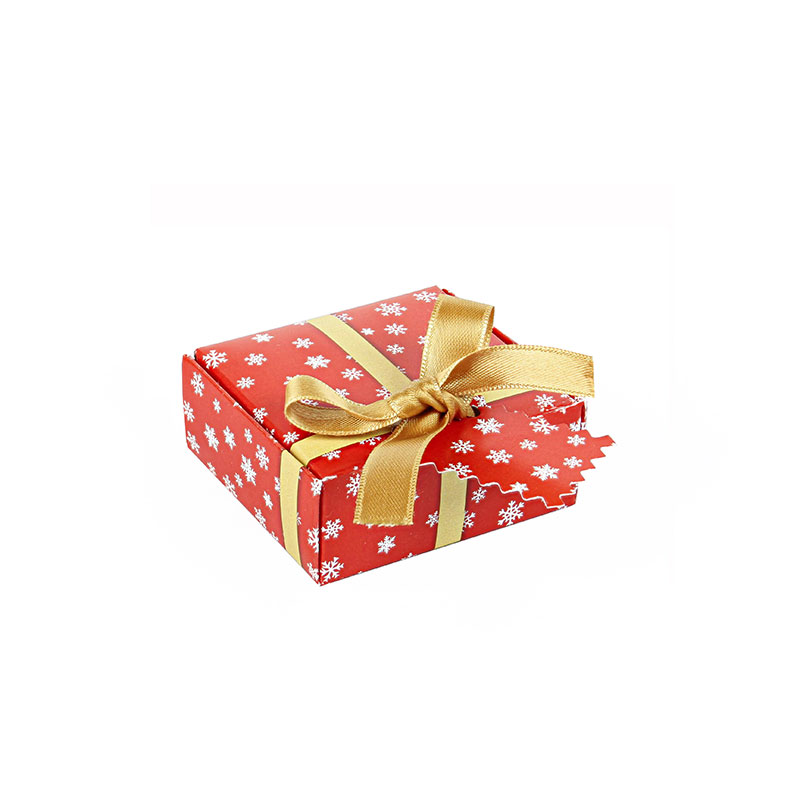Glossy cardboard universal box with red and white Snowflake pattern and gold satin ribbon